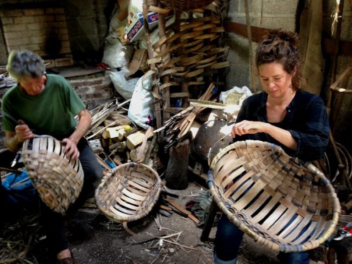 Ruby and Owen making an oak swill basket