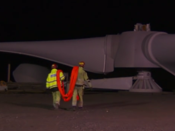 The blades of a giant wind turbine ready for installation at Awel Co-op wind farm