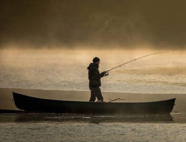 Charlie Loram of The Old Way fishing from a boat